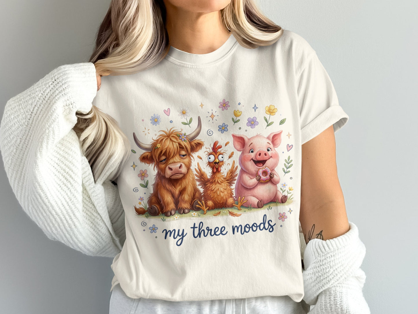 Cream t-shirt with cartoon cow, pig, and chicken.