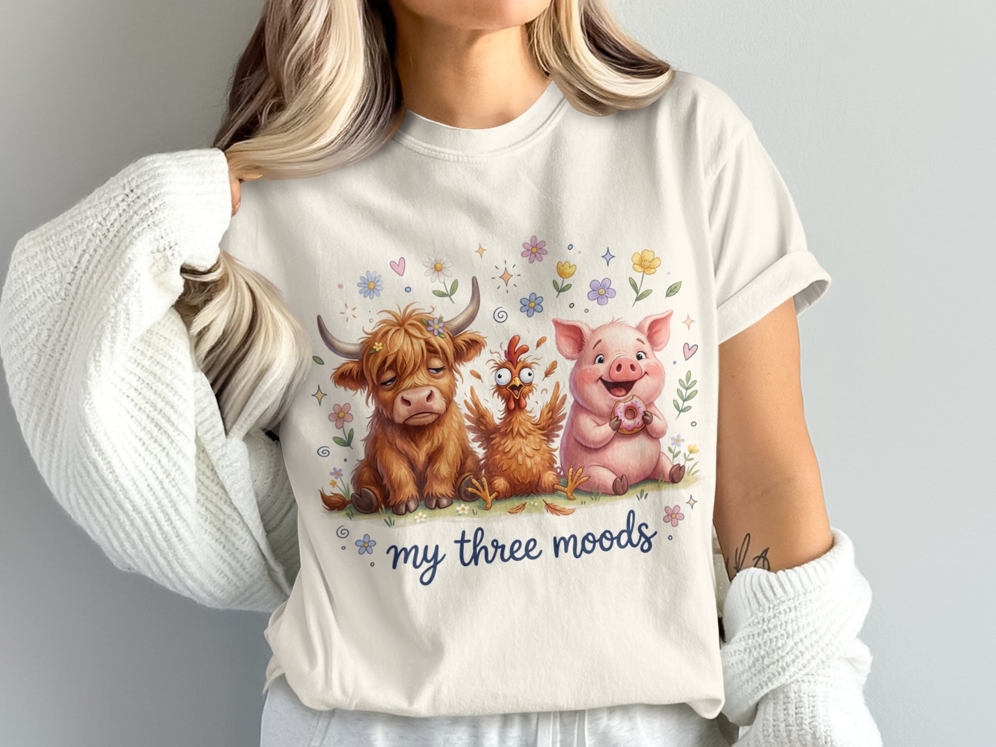 Cream t-shirt with cartoon cow, pig, and chicken.