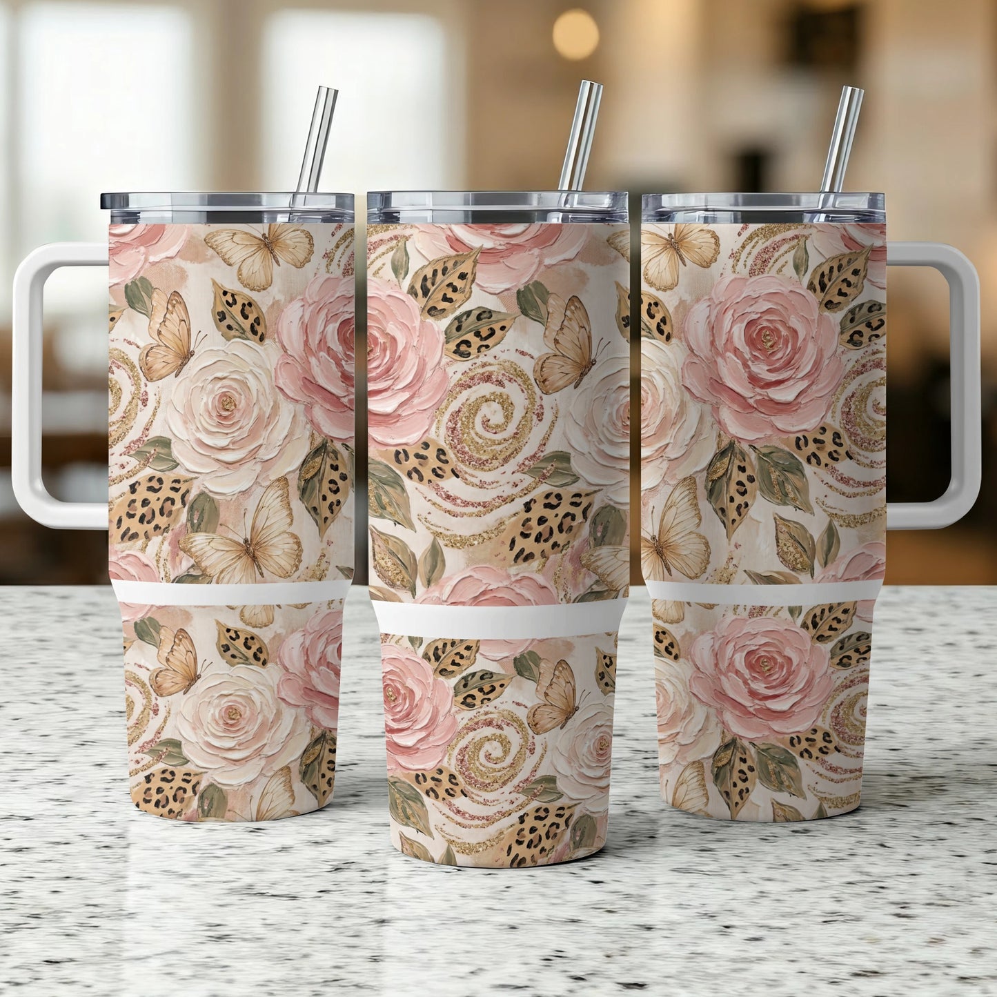Three tumblers with a floral, butterfly, and leopard print design.