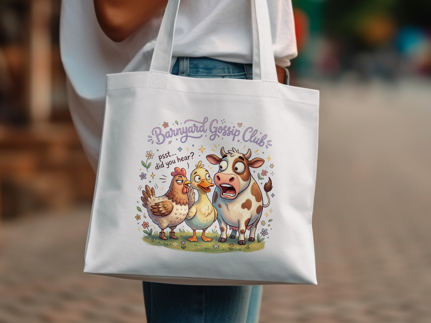 White tote bag with cartoon cow, chicken, and duck discussing gossip.