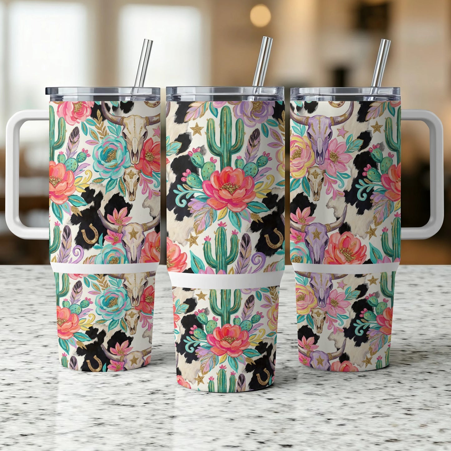 Three tumblers with cow skull, cactus, and floral Western pattern.