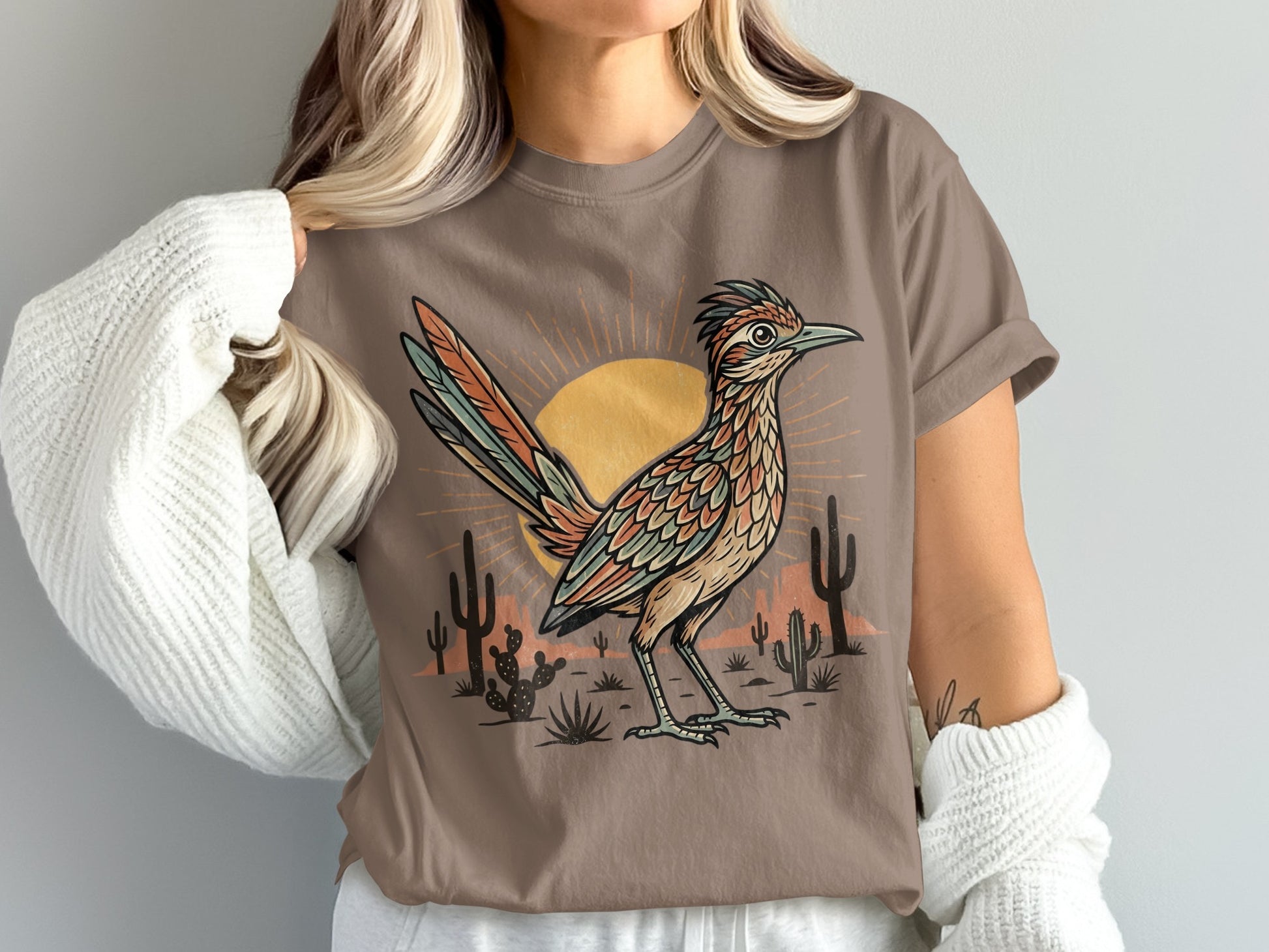 Brown t-shirt with roadrunner and desert scene graphic.