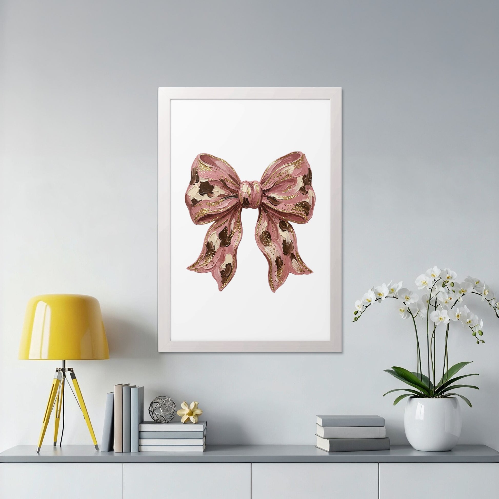 Pink bow illustration with gold accents in a white frame.