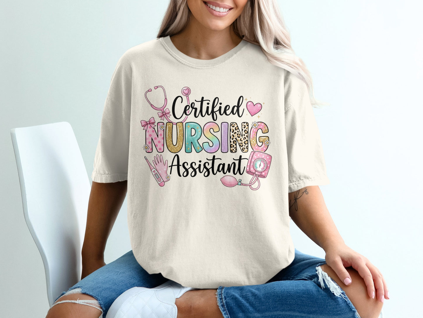 Cream t-shirt with "Certified Nursing Assistant" text and medical graphics.
