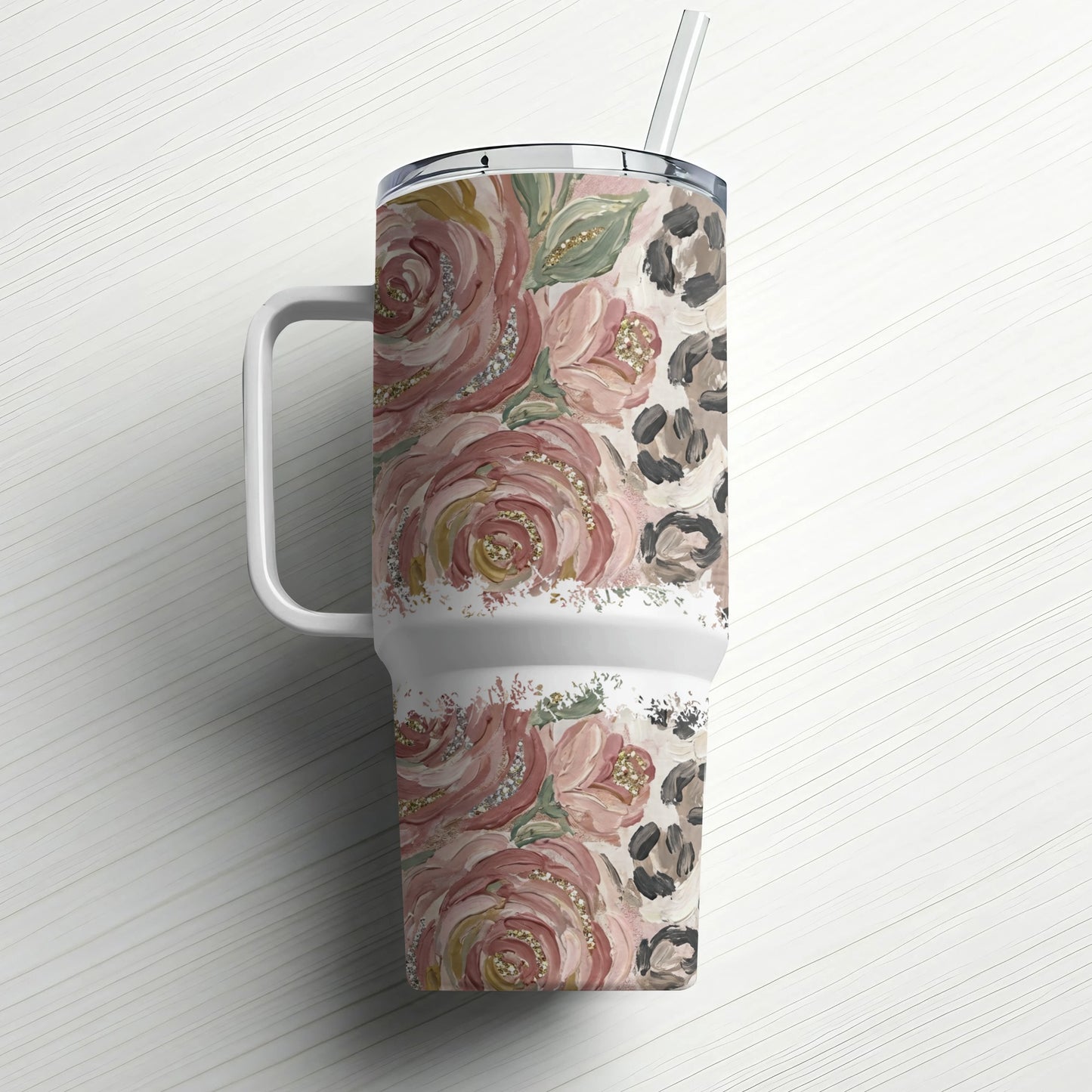 Pink floral and leopard print tumbler with glitter accents and straw.