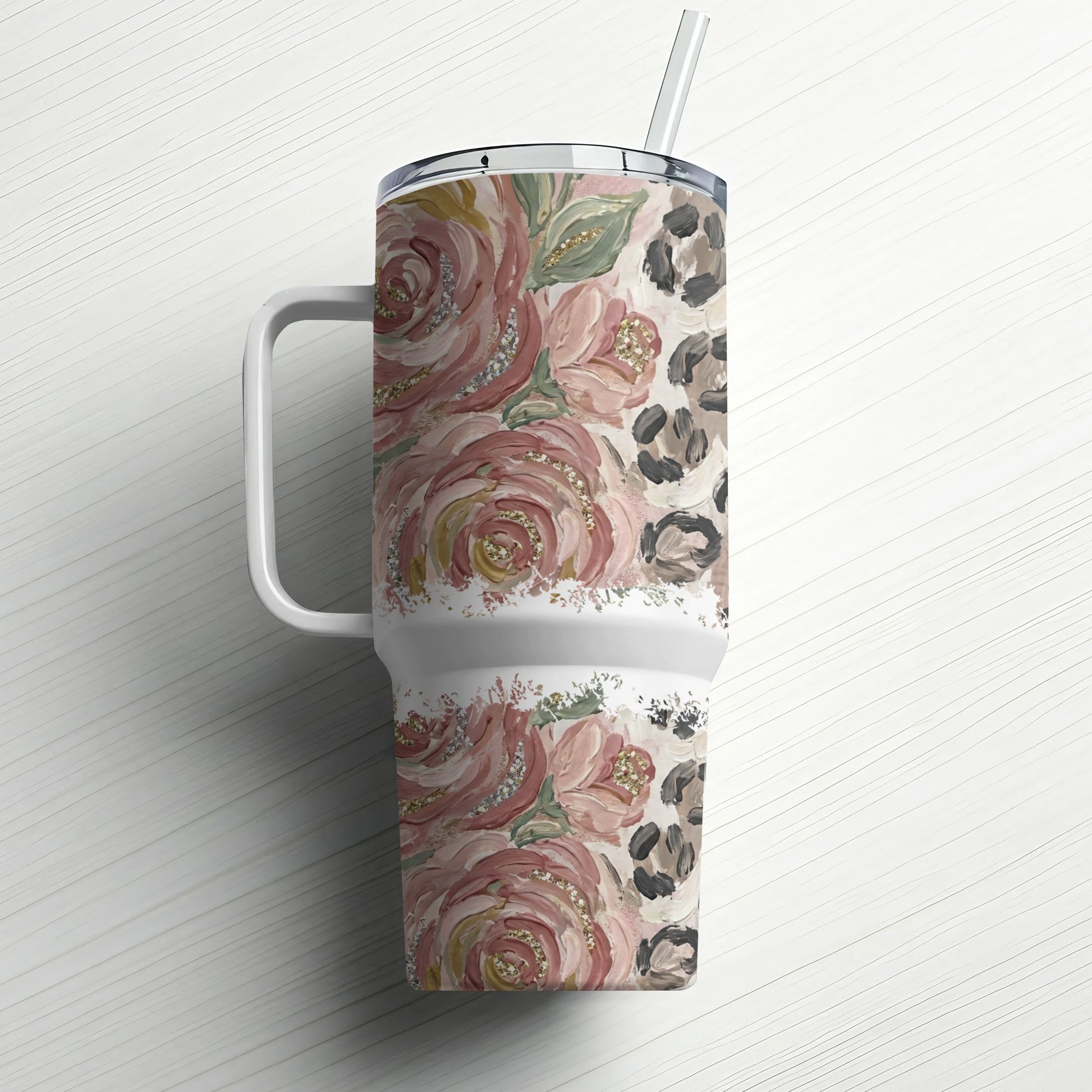 Pink floral and leopard print tumbler with glitter accents and straw.