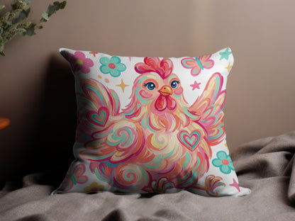 Colorful abstract chicken with hearts and flowers on a decorative pillow.