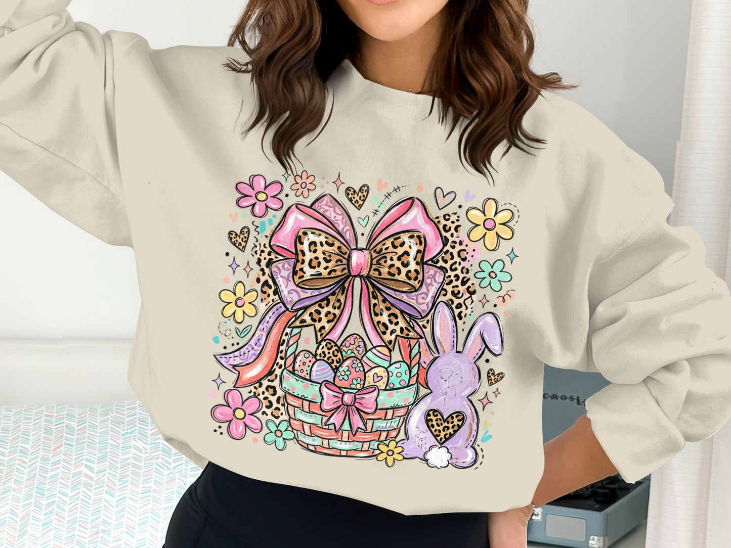 Cream sweatshirt with Easter basket, bunny, and floral graphics.