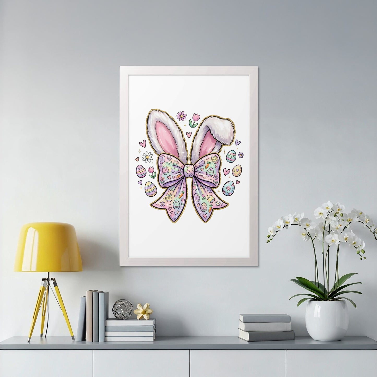Framed Easter art with bunny ears, bow, and decorated eggs.