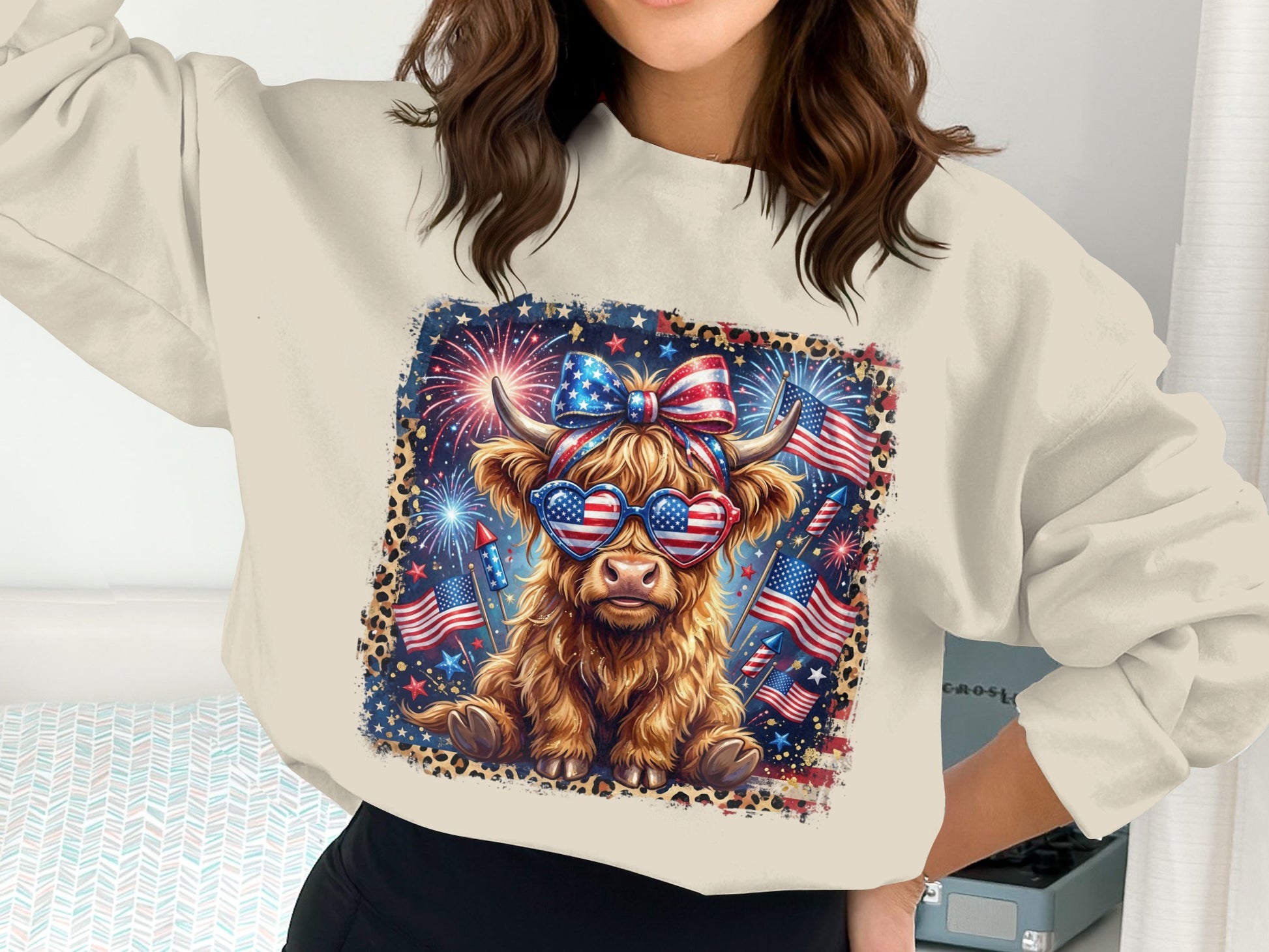 Highland cow wearing American flag bandana and heart sunglasses, with fireworks.