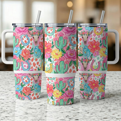 Three tumblers with floral, cactus, and horseshoe designs.