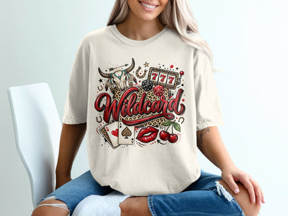 Cream t-shirt with wild card, bull skull, dice, cherries, and casino symbols graphic.
