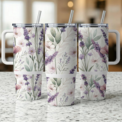 Three tumblers with lavender and floral print and white handles.