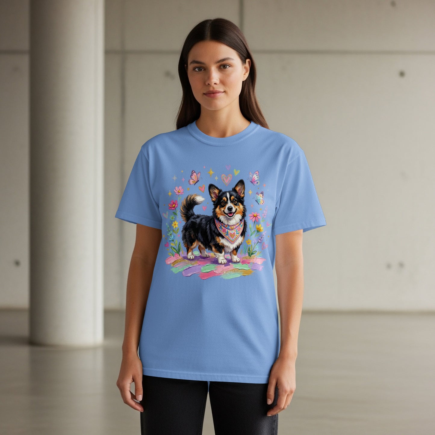 Blue t-shirt with corgi wearing bandana, surrounded by flowers and butterflies.