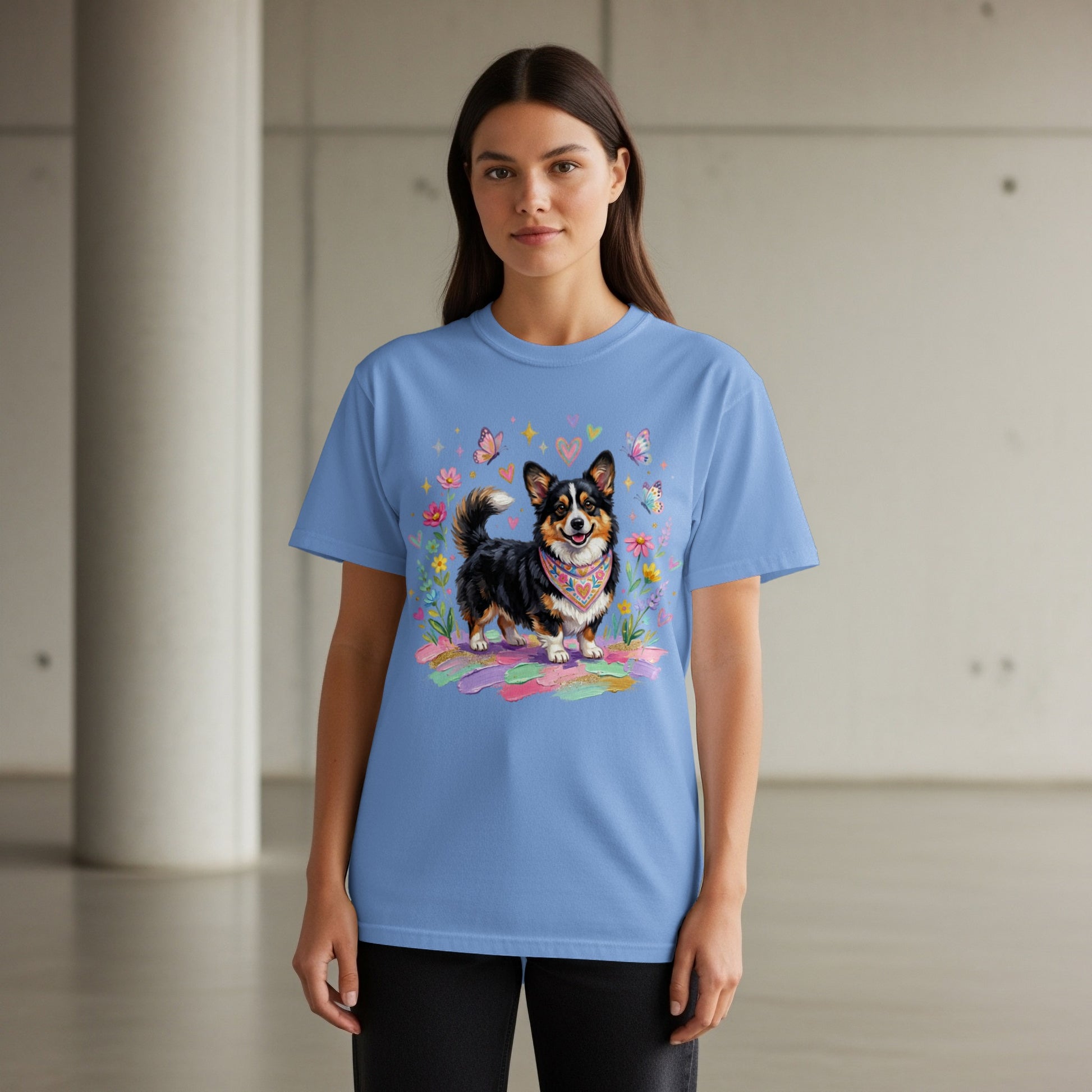 Blue t-shirt with corgi wearing bandana, surrounded by flowers and butterflies.