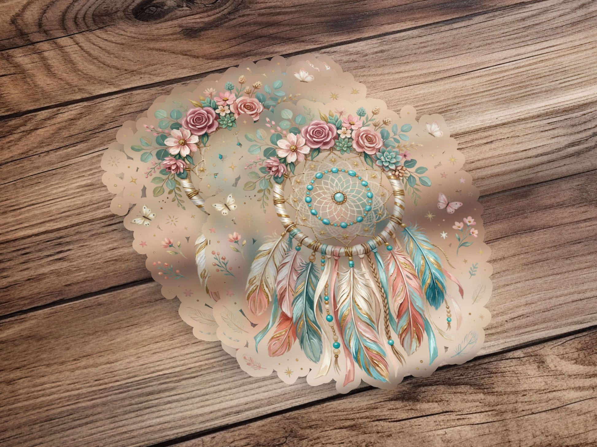 Dreamcatcher with feathers and flowers, on a wooden background.