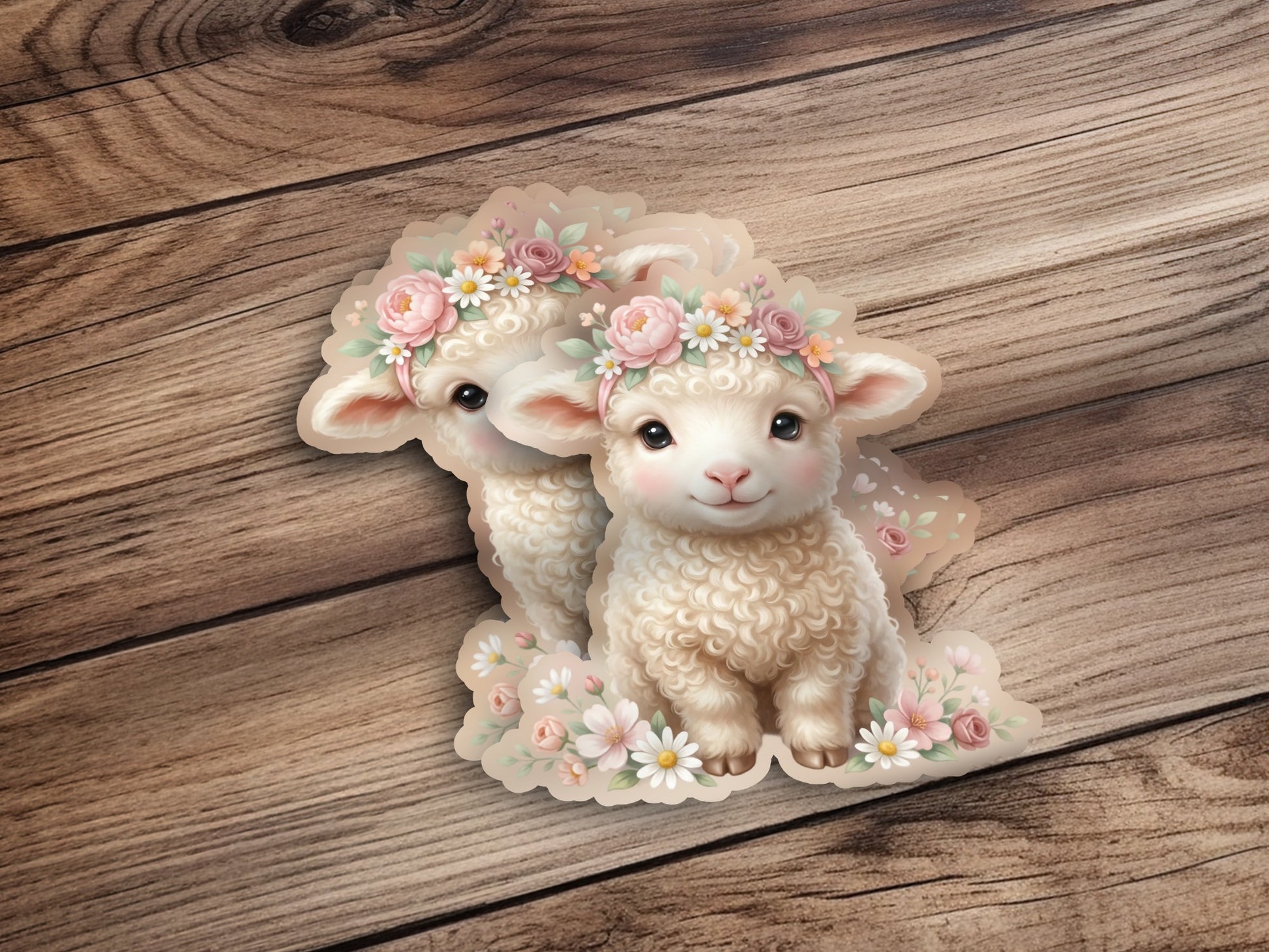 Two fluffy sheep wearing flower crowns on a wooden background.