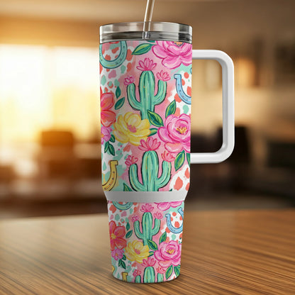 Tumbler with cactus, horseshoe, and floral pattern.