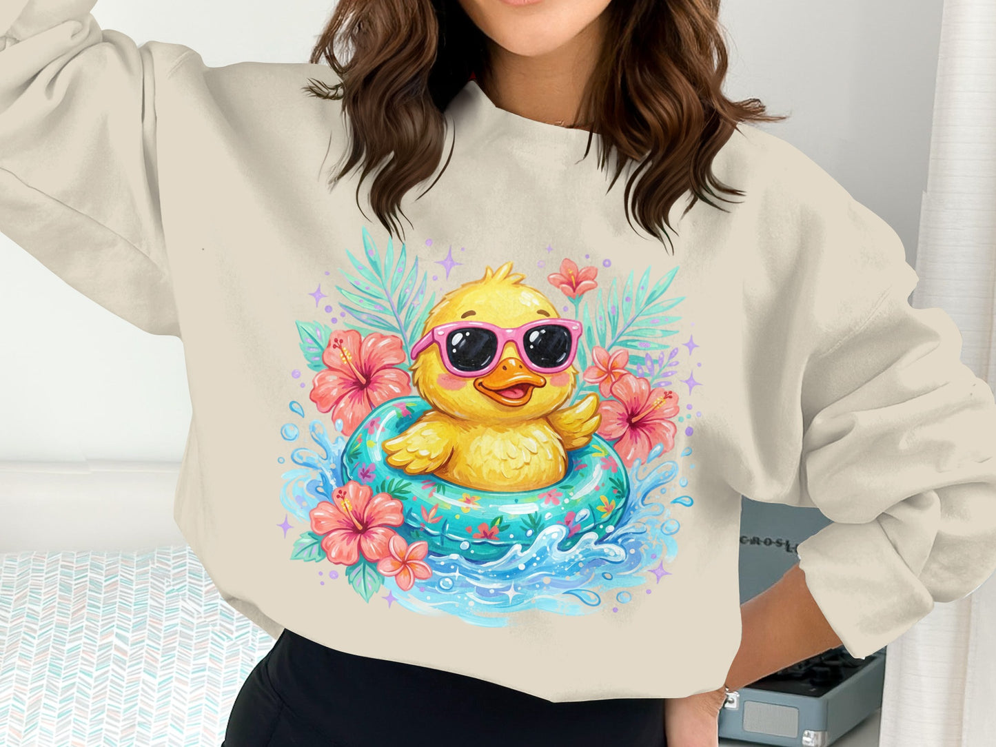 Yellow duck in sunglasses floats in inflatable ring with tropical flowers.