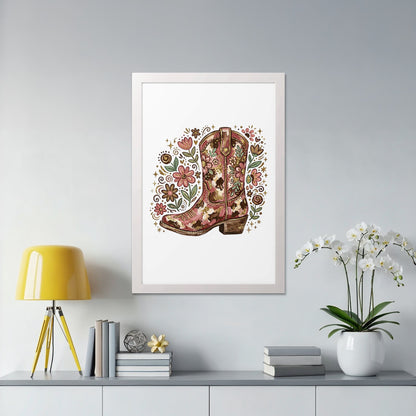 Pink cowboy boot adorned with floral and Western motifs, framed.