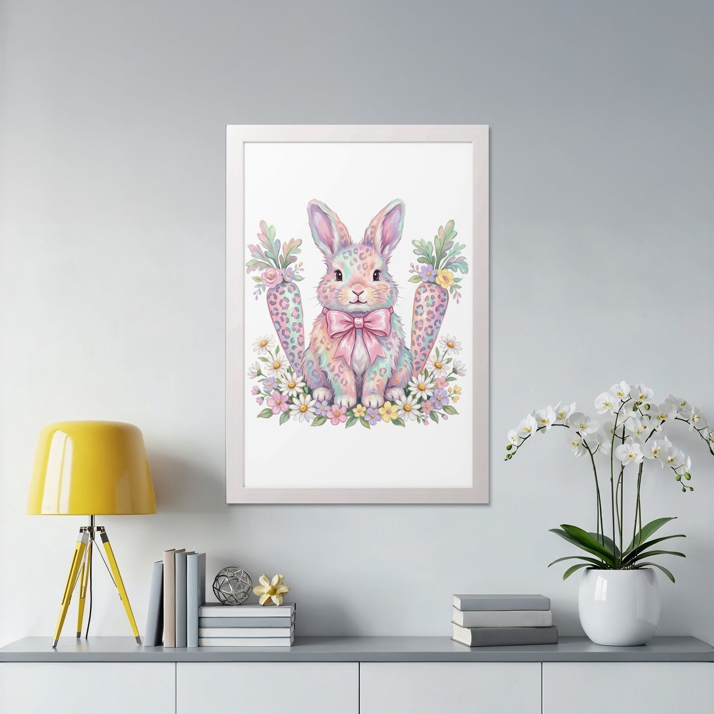 Framed artwork of a pastel bunny with carrots and flowers.