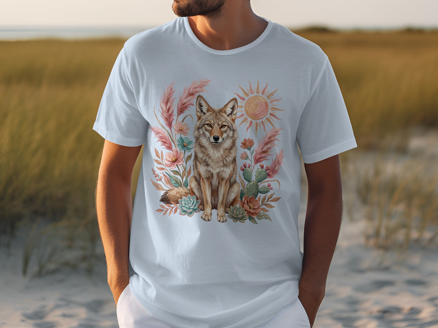 Light blue t-shirt with desert scene featuring a coyote, sun, and cacti.