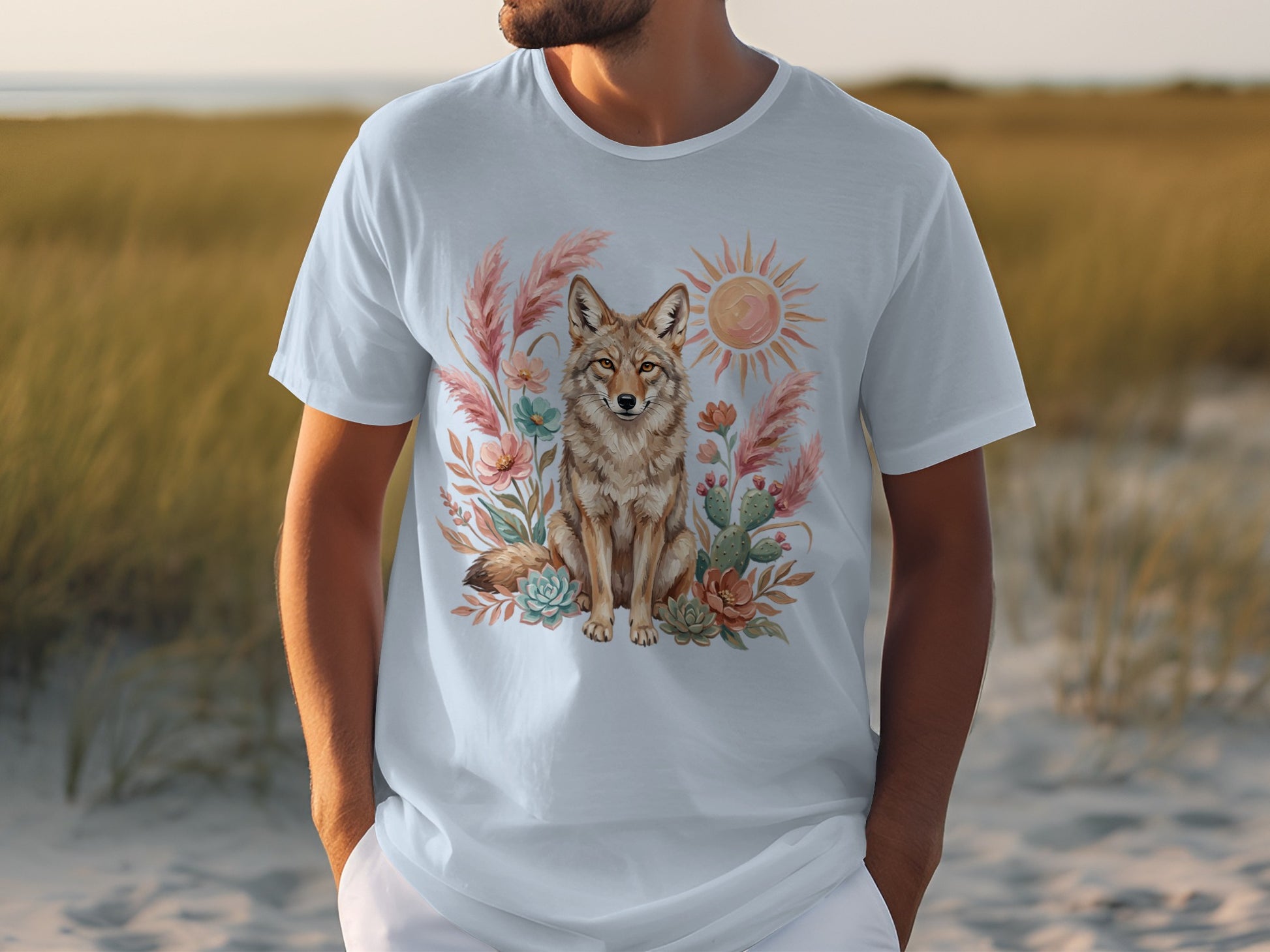 Light blue t-shirt with desert scene featuring a coyote, sun, and cacti.