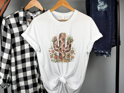 White t-shirt with a pink floral cactus design and cheetah print accents.