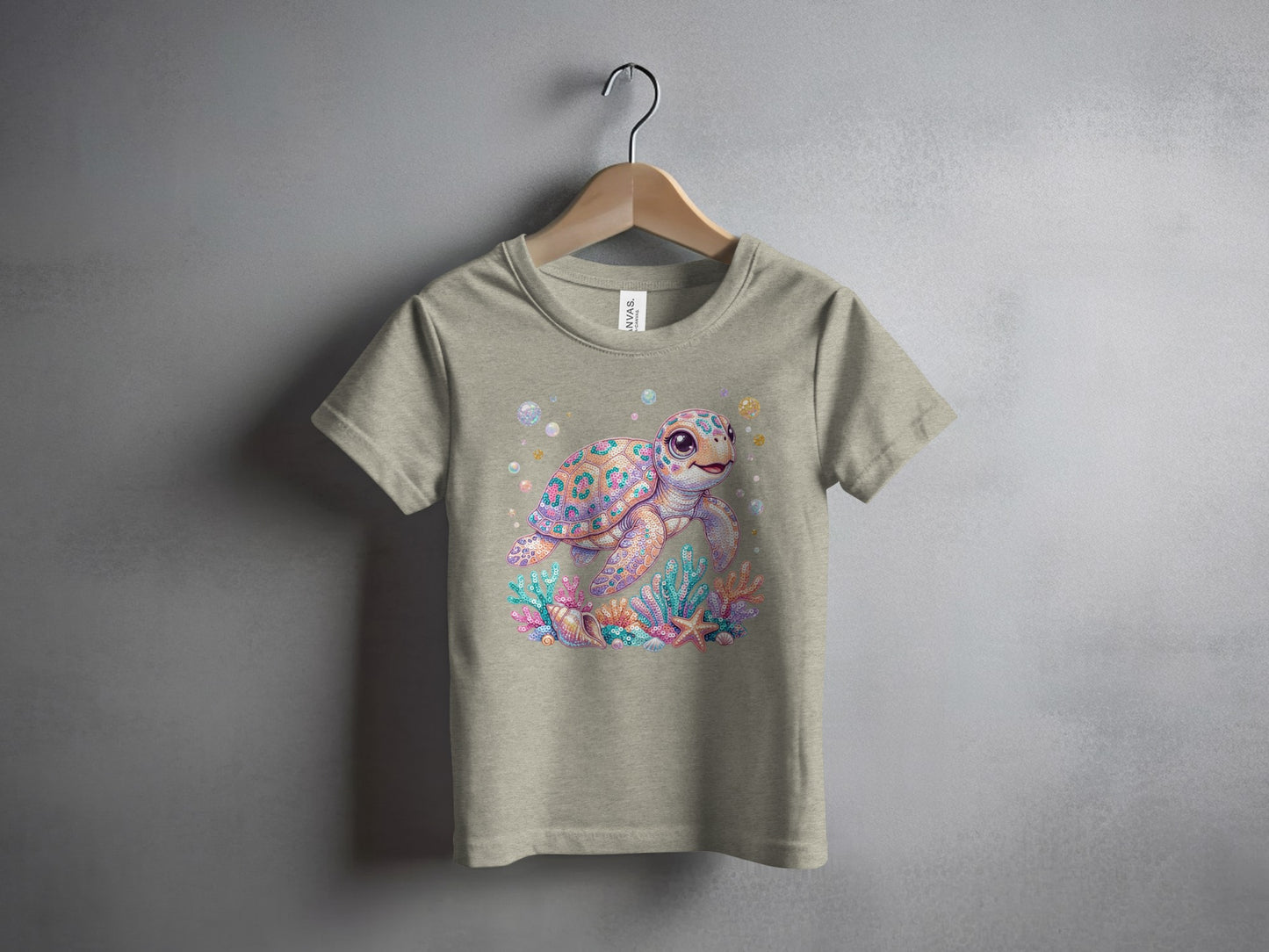T-shirt featuring a colorful cartoon sea turtle swimming among coral and starfish.