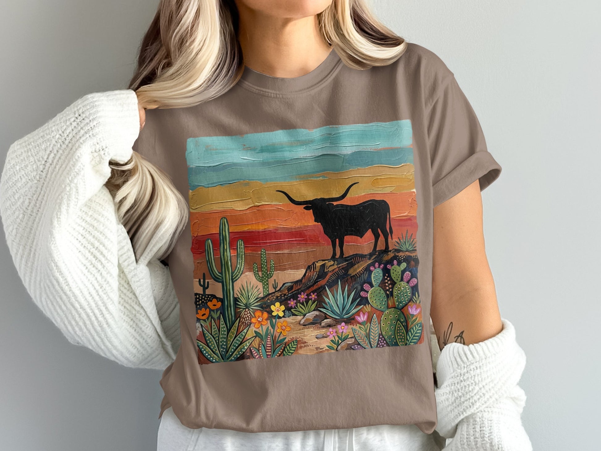 Brown t-shirt with distressed longhorn bull and desert cactus landscape art.