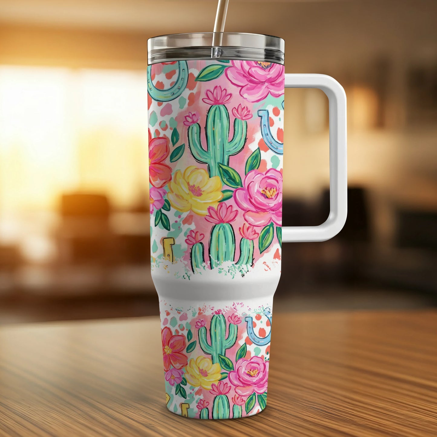 Tumbler with colorful cactus, floral, and horseshoe pattern, white handle.