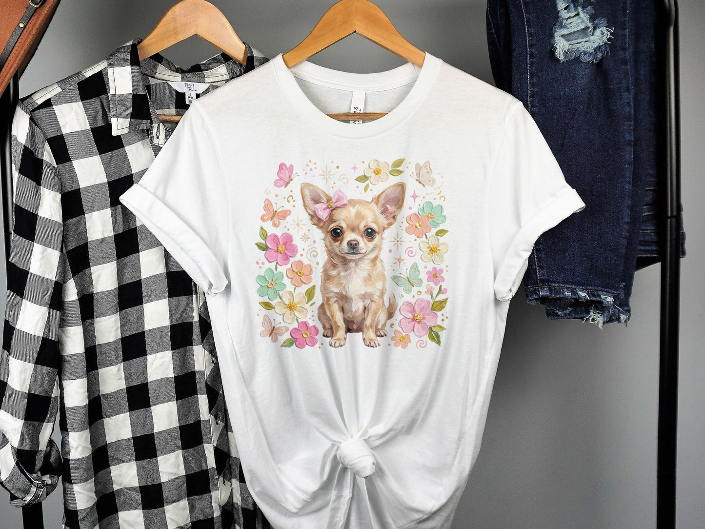 Chihuahua puppy with bow and butterflies on floral graphic t-shirt.