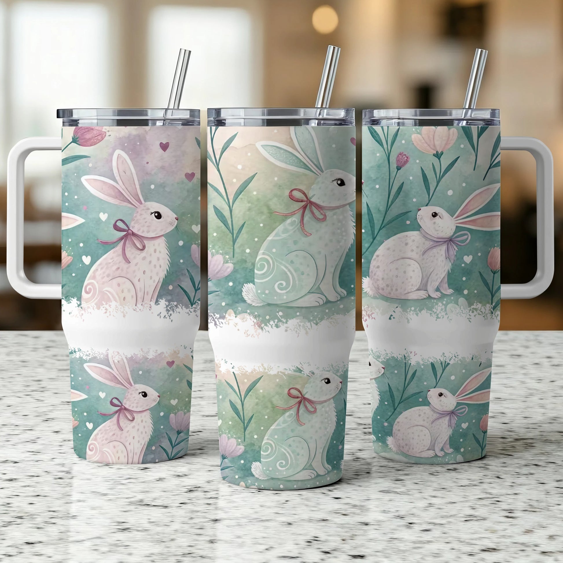 Three tumblers with Easter bunnies, pastel flowers, and watercolor details.