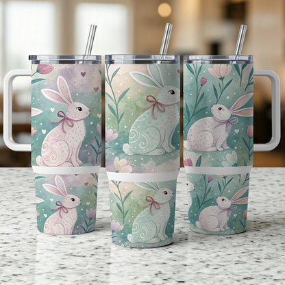 Three tumblers with a pastel bunny and floral design.