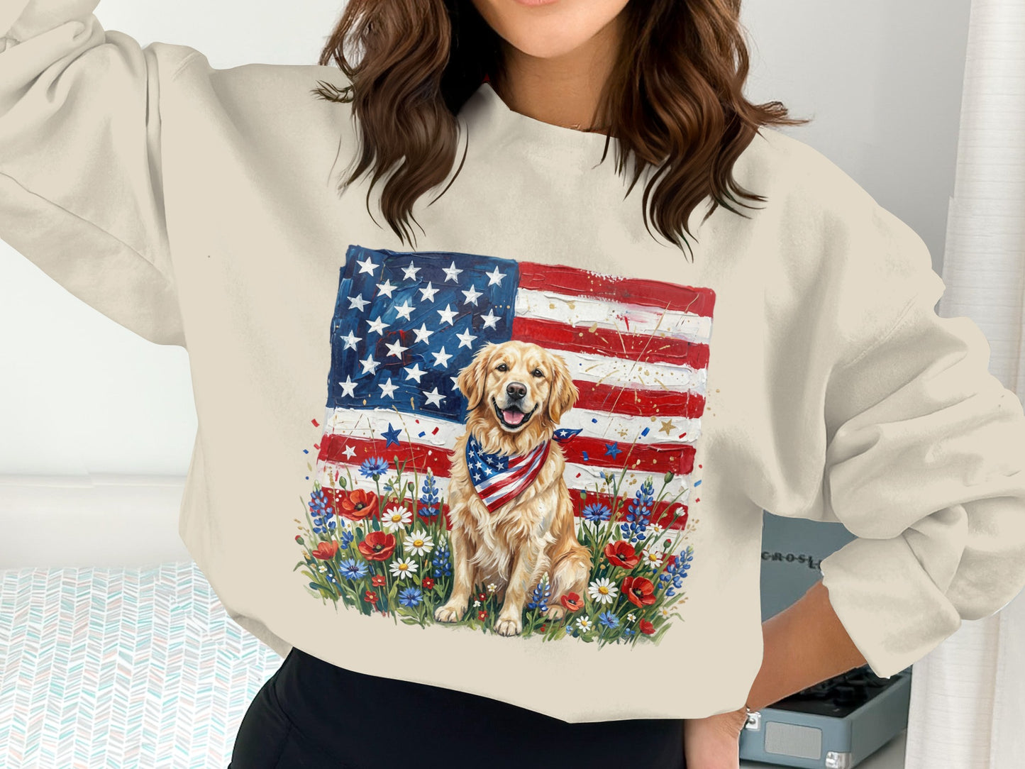 Golden Retriever wearing a bandana sits in front of a patriotic American flag and wildflowers.