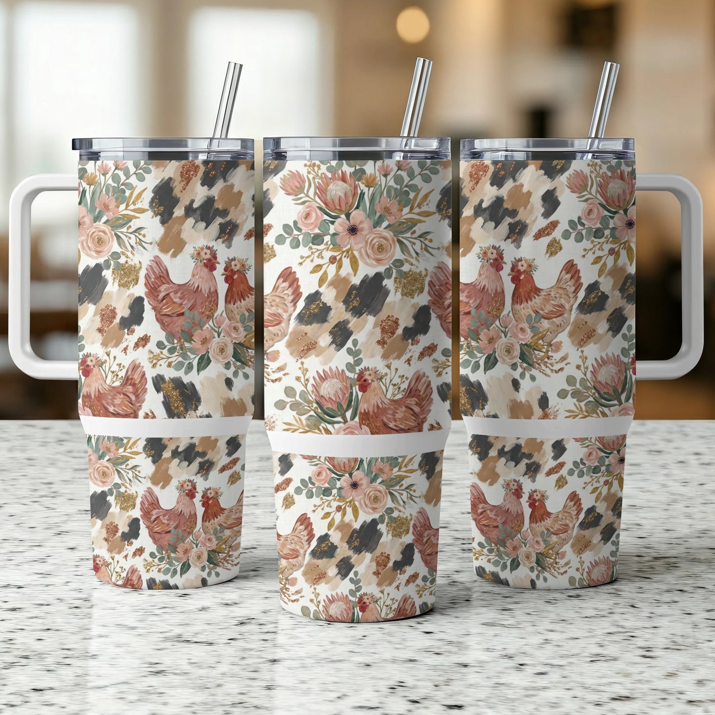 Three tumblers with chicken and floral designs on a counter.