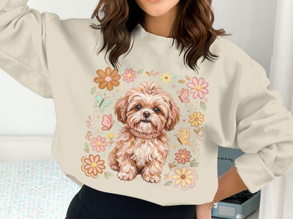 Cream sweatshirt with a cute puppy surrounded by flowers and butterflies.