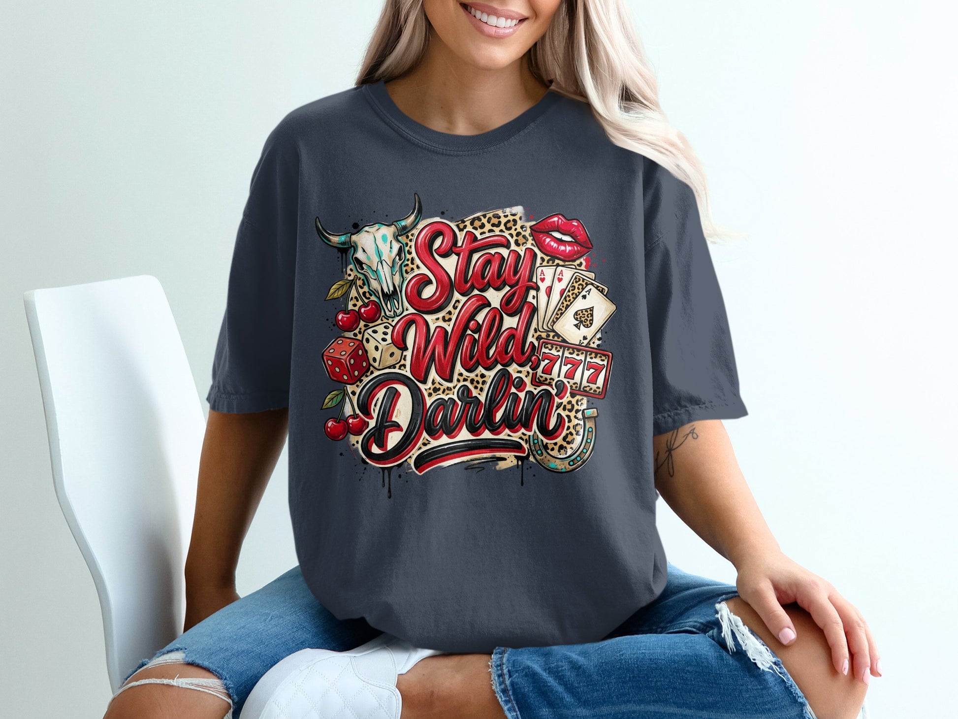 Dark grey t-shirt with "Stay Wild Darlin'" text, casino and rockabilly graphics.
