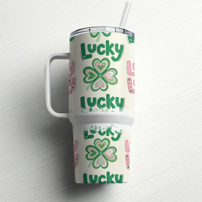 Green lucky clover pattern on insulated tumbler with handle and straw.