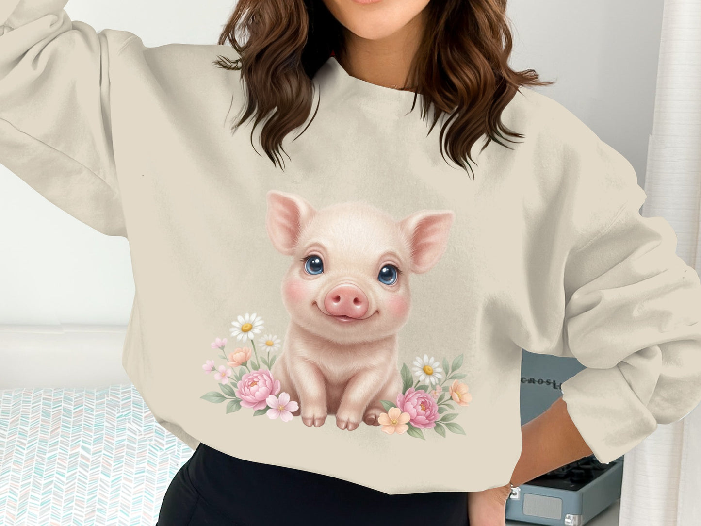 Cute piglet with flowers graphic on a cream sweatshirt.