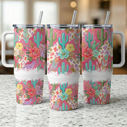 Three tumblers with a colorful floral and cactus pattern and white handles.