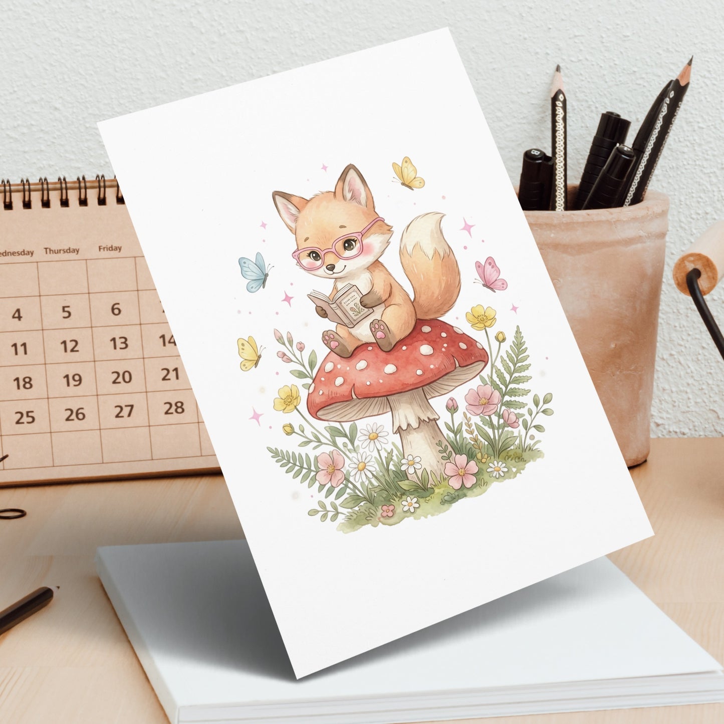 Illustration of a fox reading on a mushroom surrounded by flowers and butterflies.