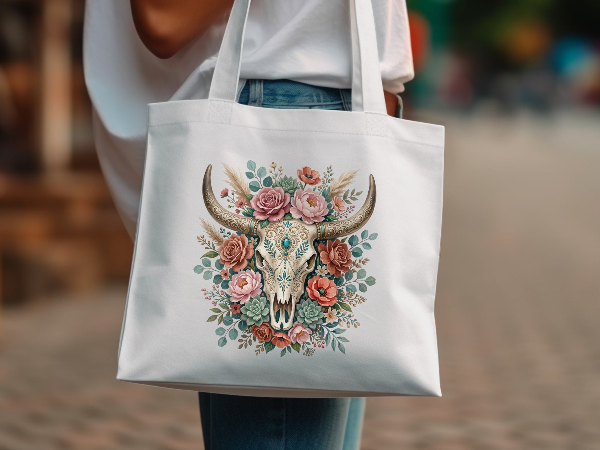 White tote bag with a floral bull skull graphic and rustic accents.
