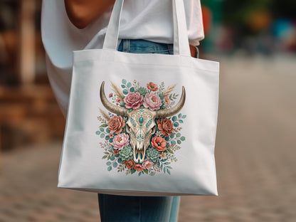 White tote bag with a floral bull skull graphic and rustic accents.
