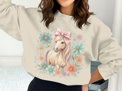 Cream sweatshirt with a pastel horse and floral design.
