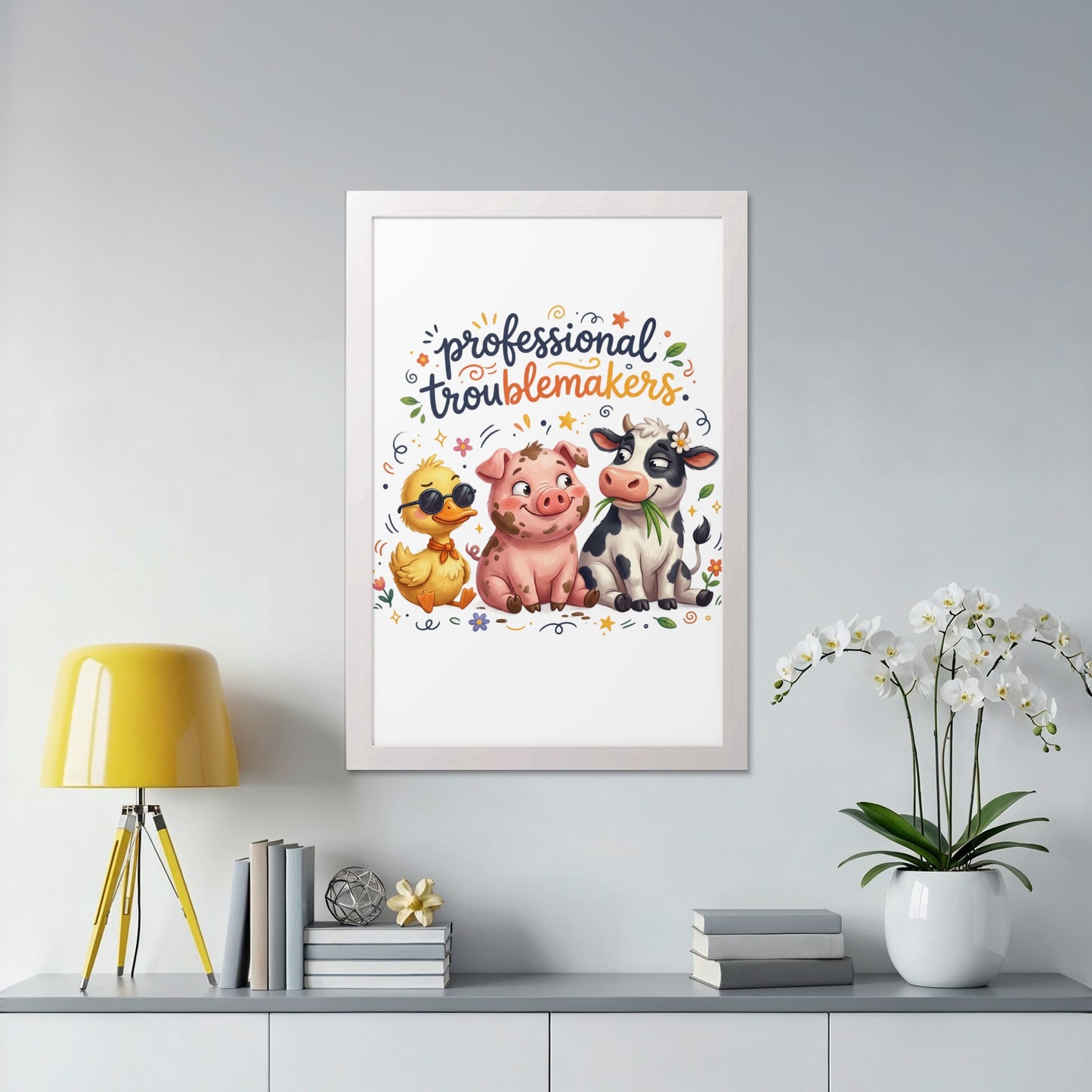Three cartoon farm animals, a duck, pig, and cow, in a framed picture.