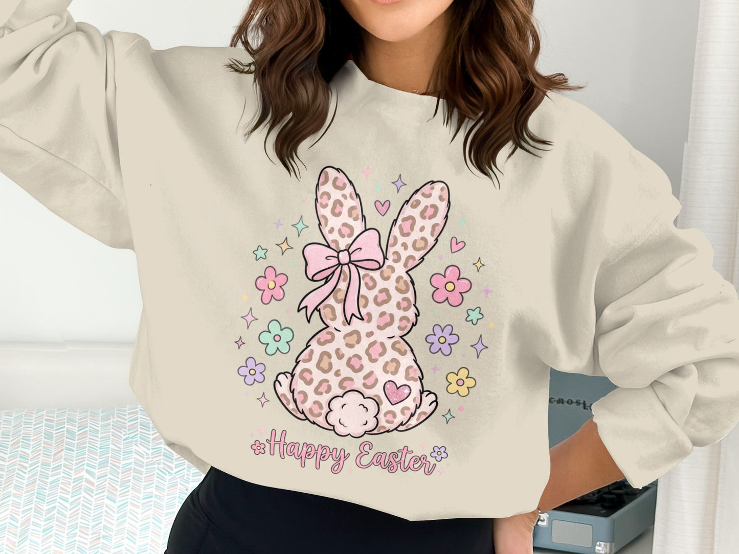 Cream sweatshirt with pink bow, leopard print bunny, and "Happy Easter" text.