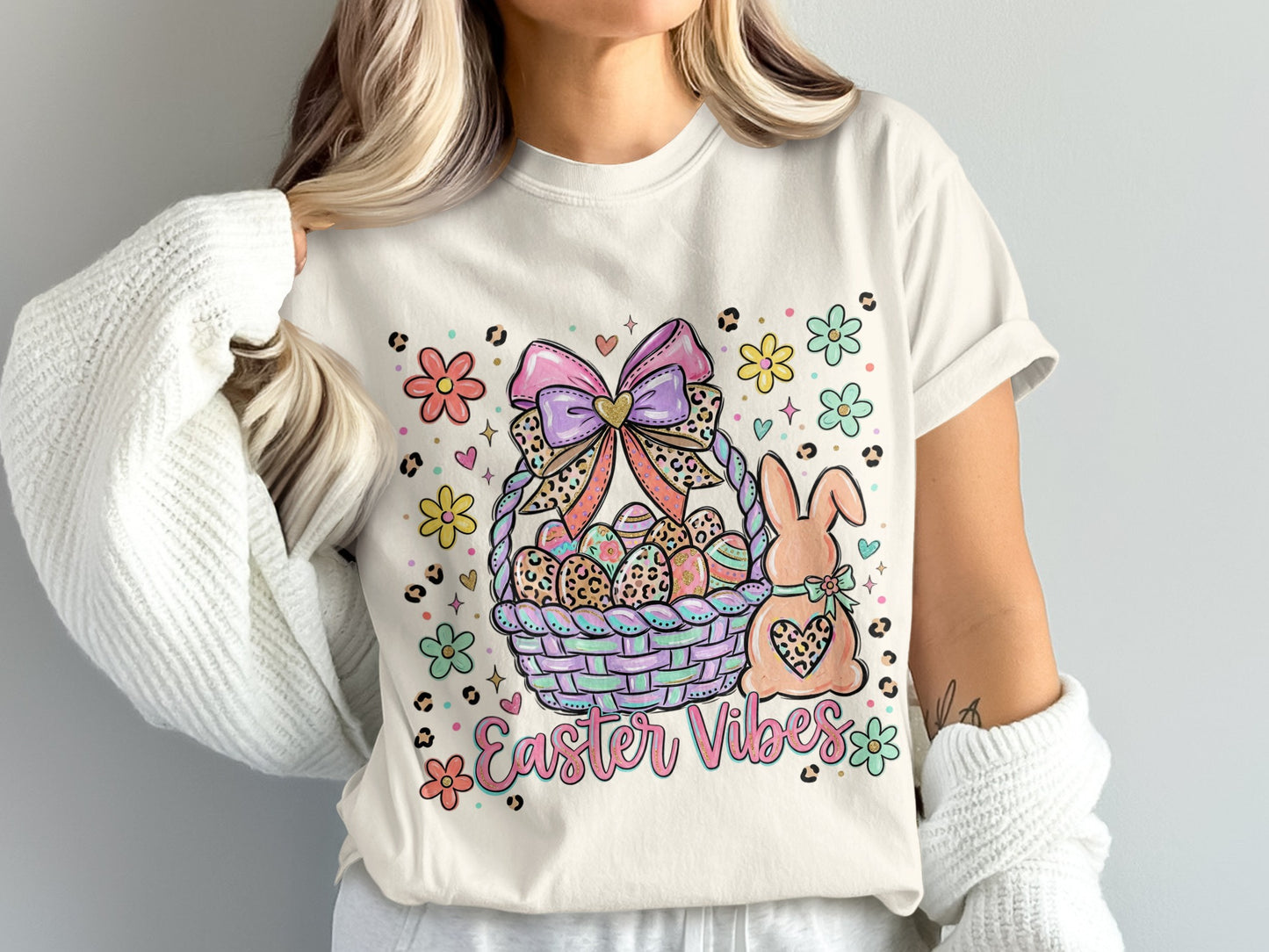 Easter basket with bunny, eggs, and "Easter Vibes" text surrounded by flowers.