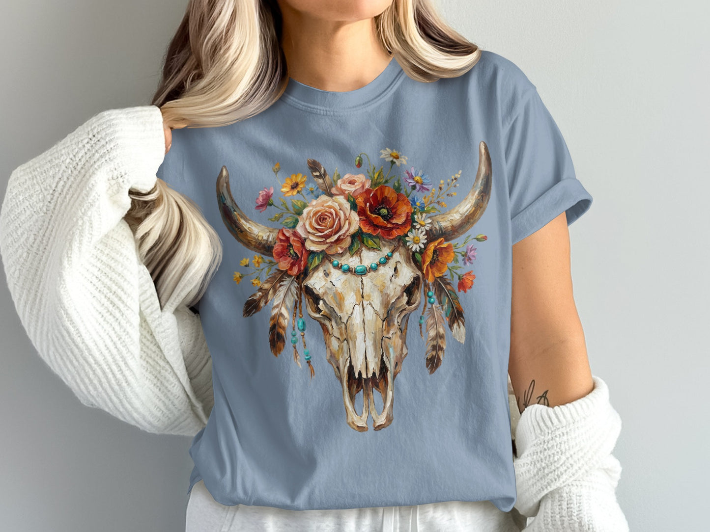 Cow skull with floral arrangement and turquoise bead necklace.