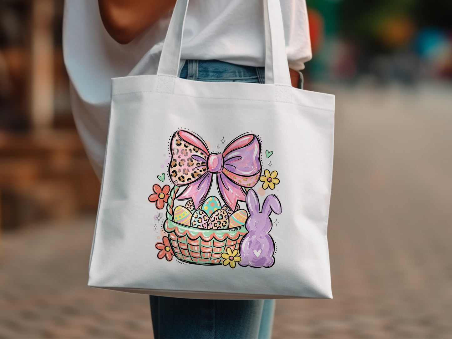 Easter basket with bunny, flowers, and pink bow design on white tote bag.
